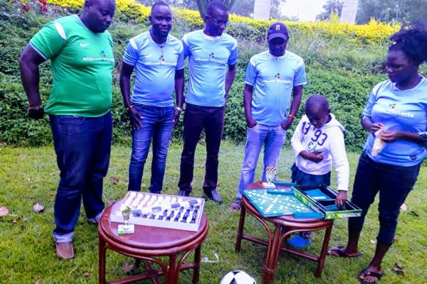 Donating sports kits, chess board and Scrabble board to Basecamp Football Club